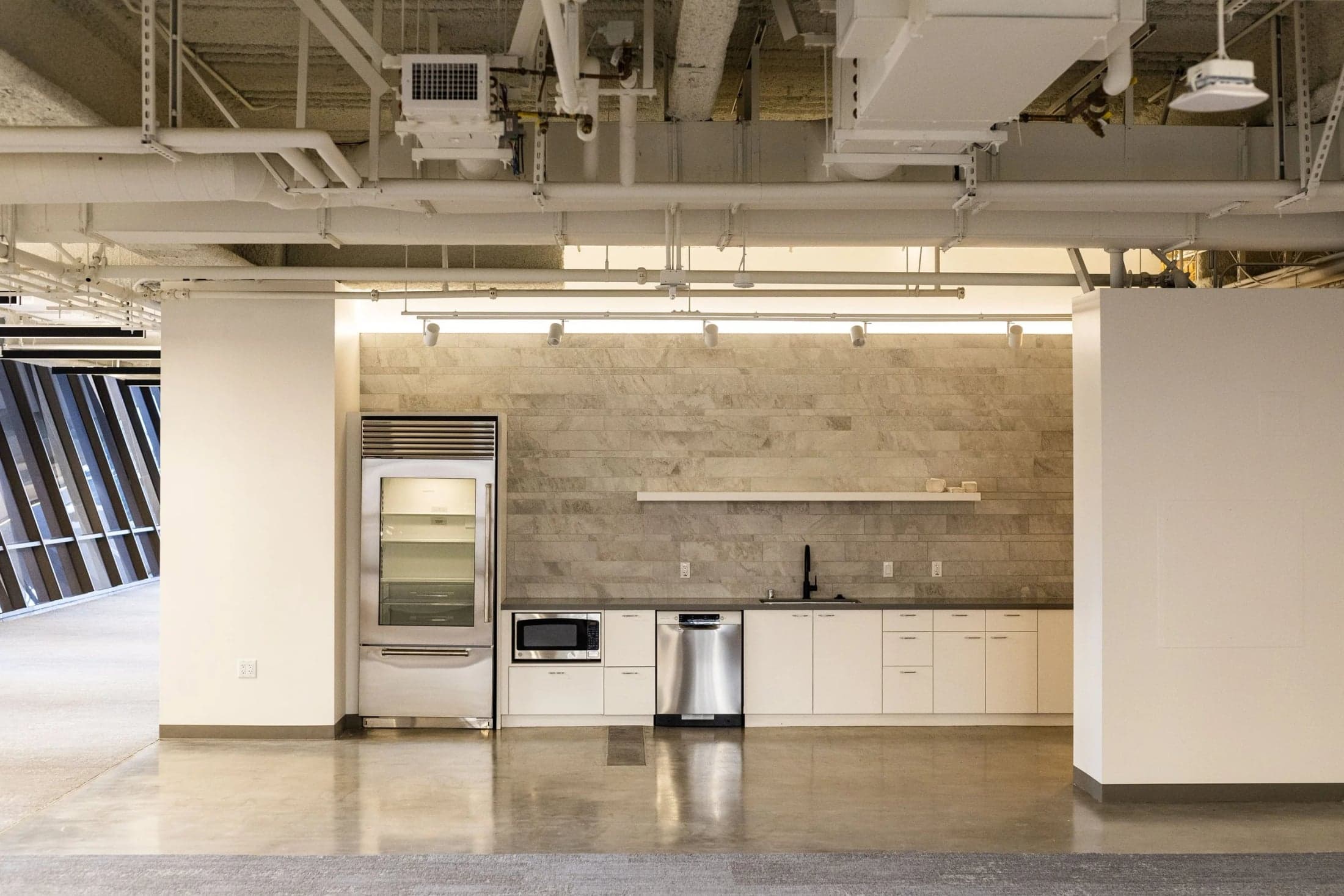 A kitchen preparation counter and refrigerators at The Sandbox.