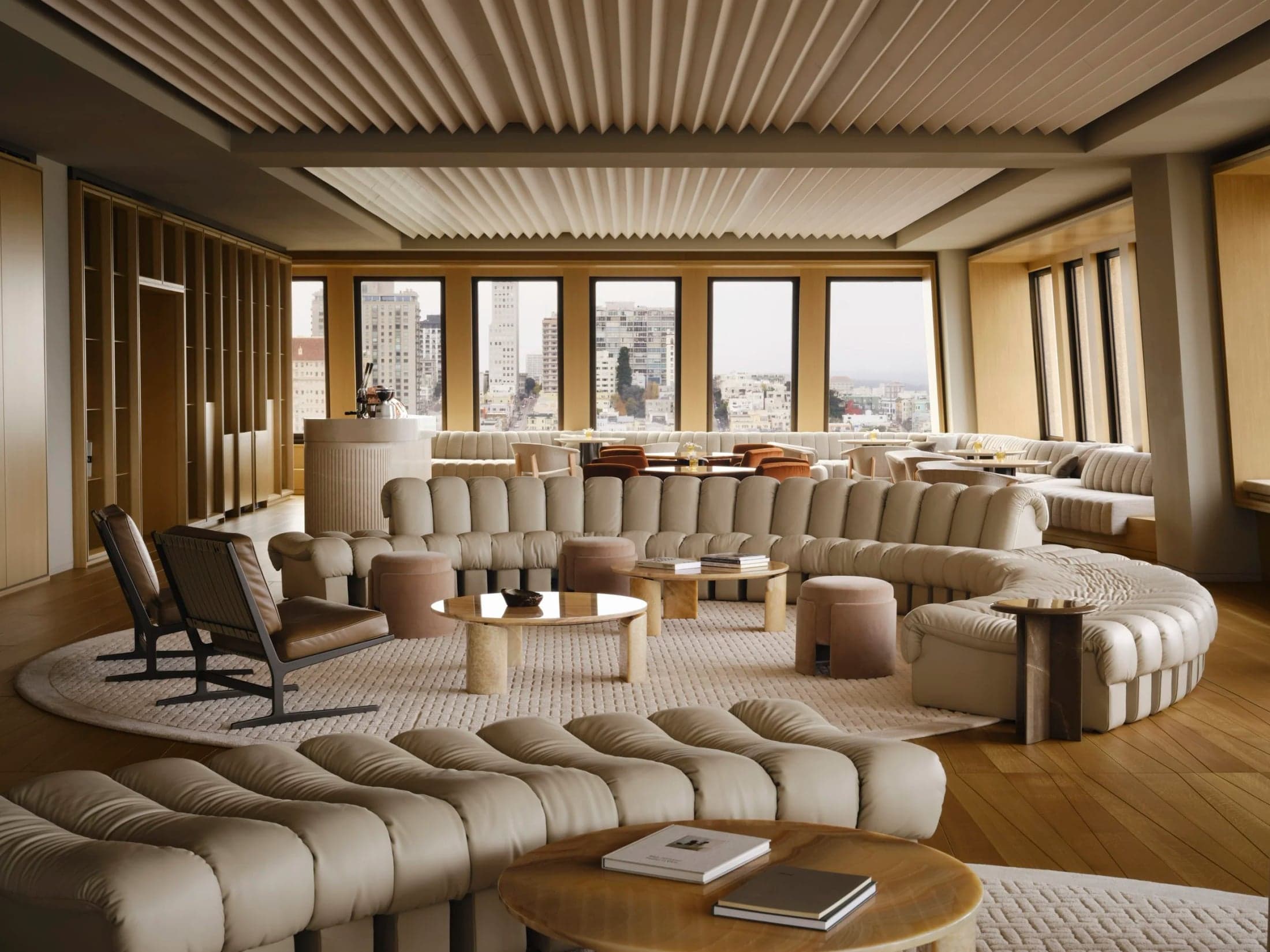 Curved modular sofas arranged across the Bay Lounge floor.