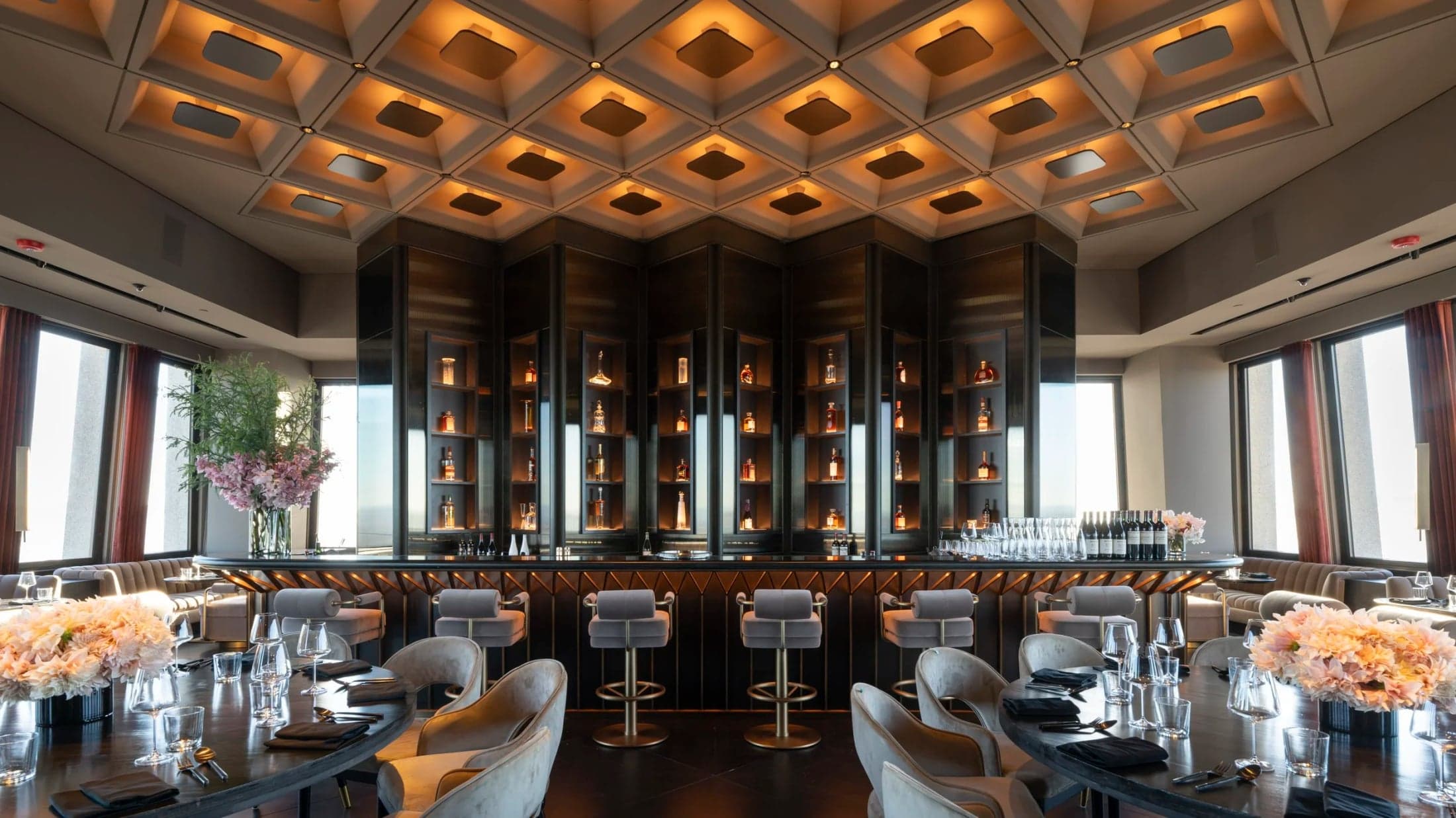 Dining tables arranged around the central bar at Sky Bar.