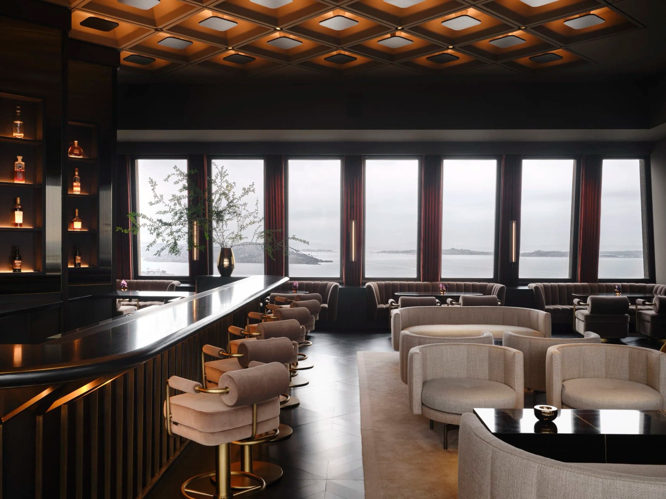A view along Sky Bar’s counter toward the lounge seating and windows.